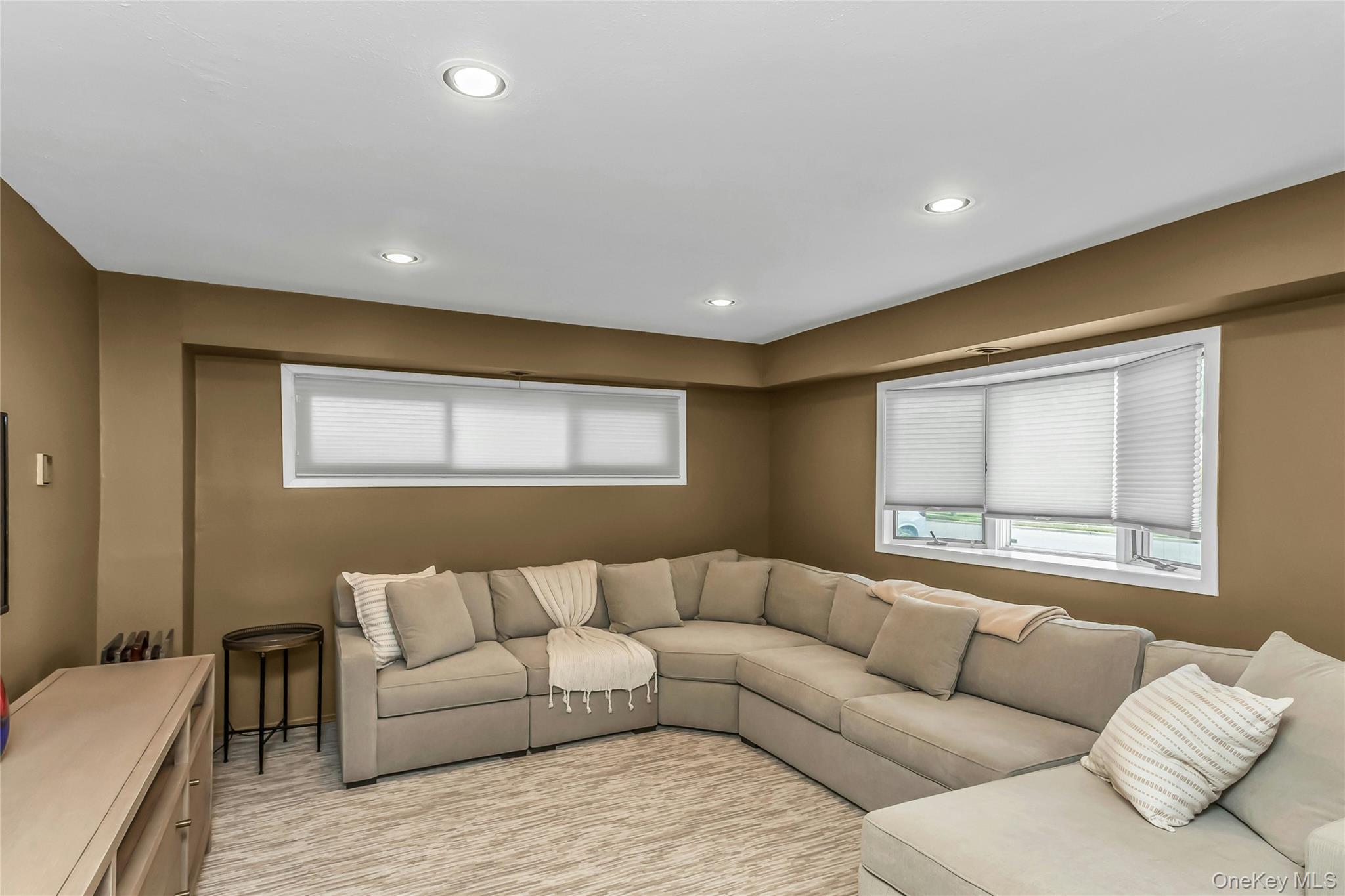 57 Joyce Road Plainview, NY 11803 - Photo 17 of 20 a living room with furniture and a large window