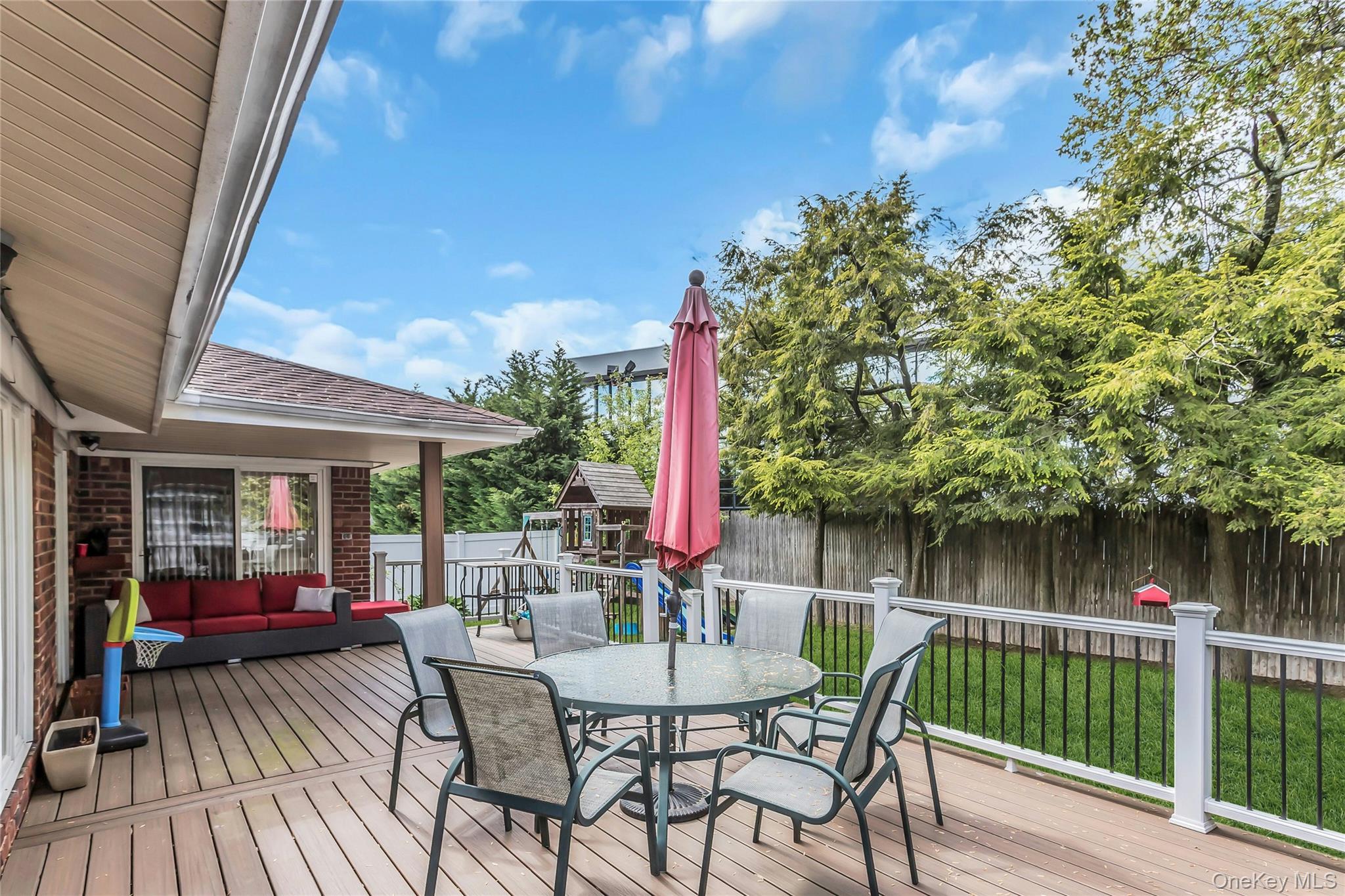 57 Joyce Road Plainview, NY 11803 - Photo 19 of 20 a view of a chair and tables in the balcony