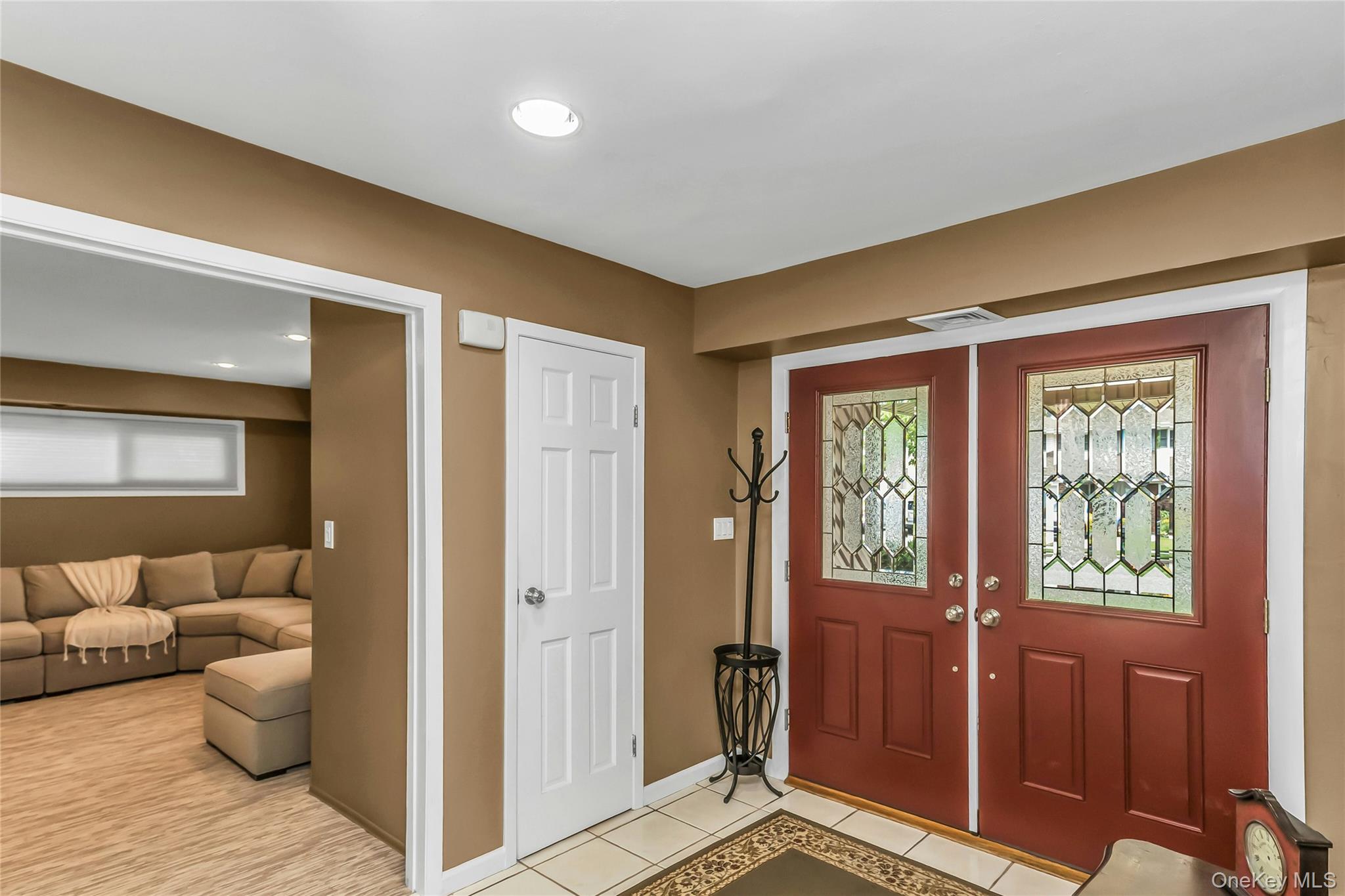 57 Joyce Road Plainview, NY 11803 - Photo 3 of 20 a view of a livingroom with furniture and windows