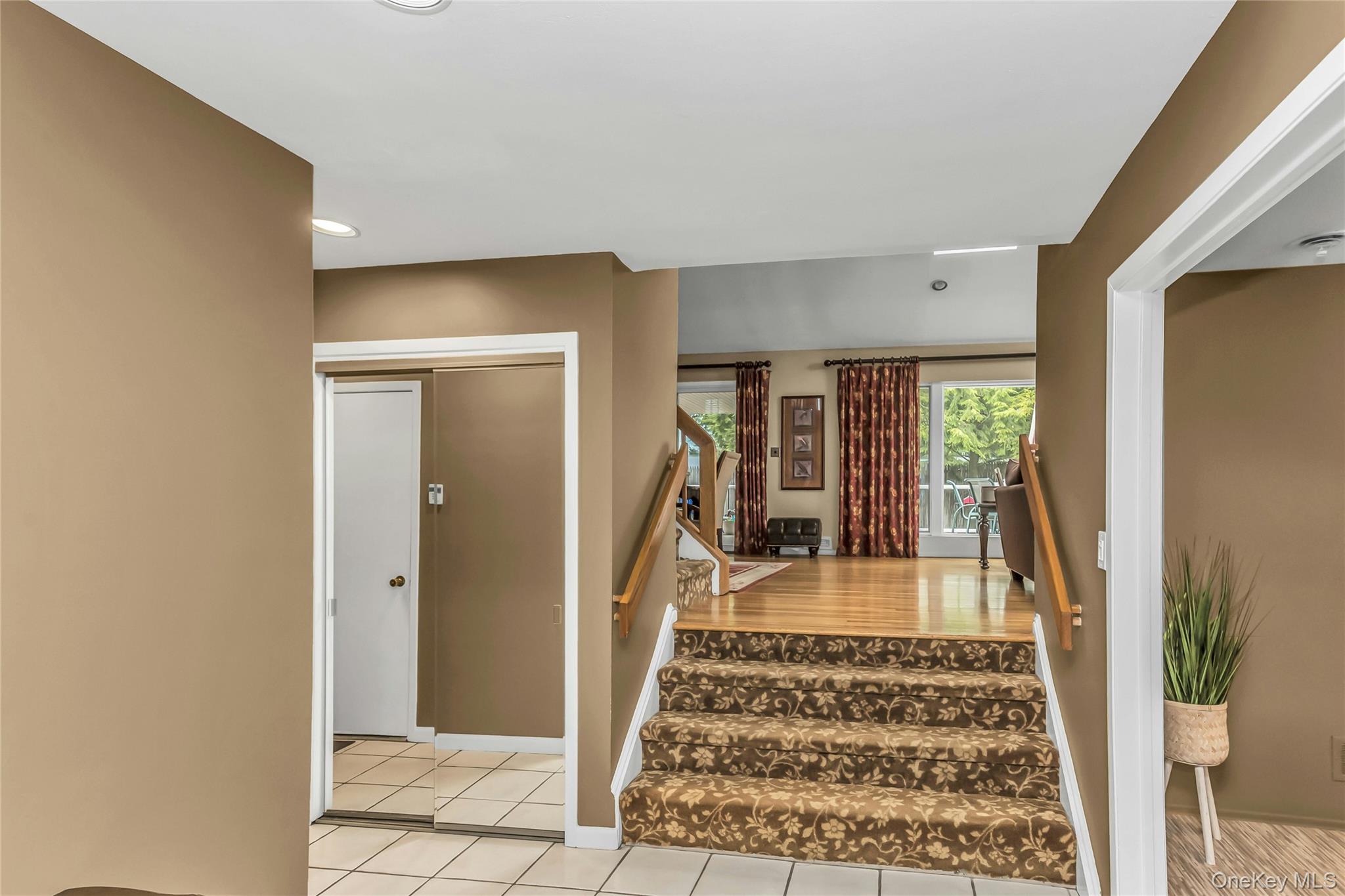 57 Joyce Road Plainview, NY 11803 - Photo 4 of 20 a view of a very nice looking room with a fireplace and a rug