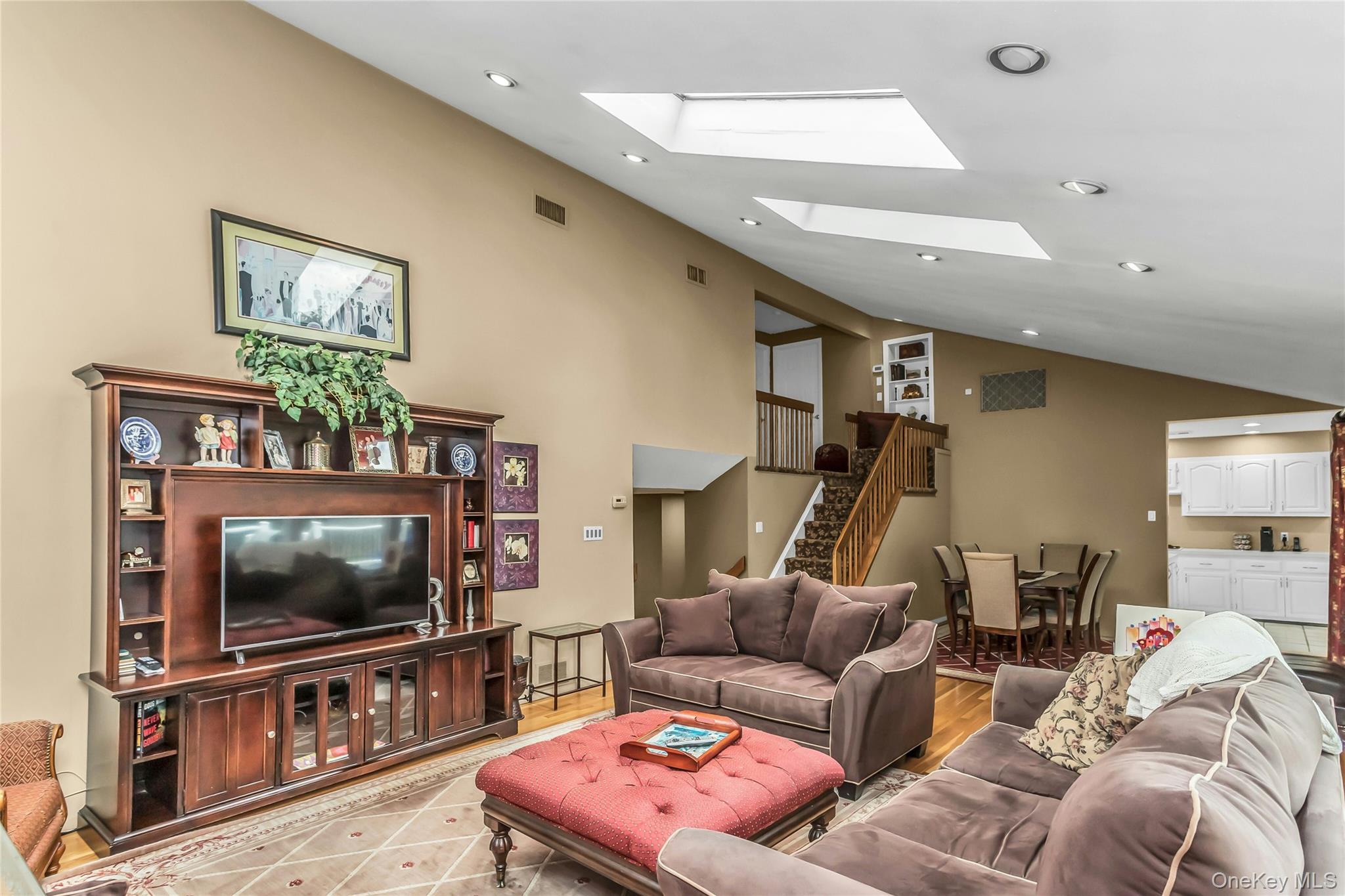 57 Joyce Road Plainview, NY 11803 - Photo 7 of 20 a living room with furniture and a flat screen tv