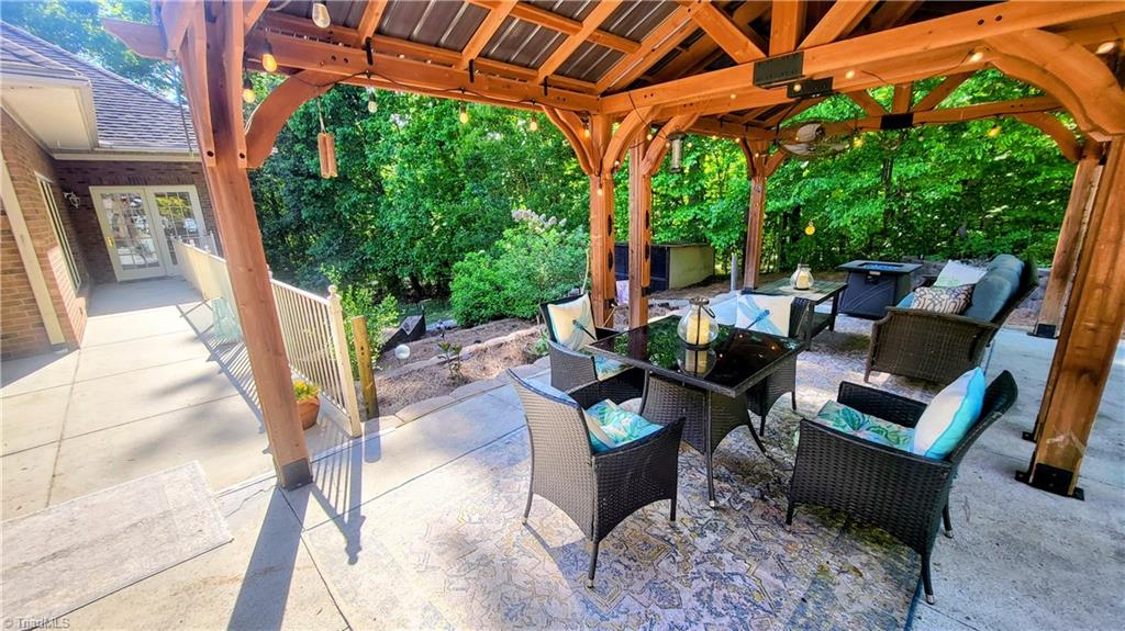 7035 Skylark Road Pfafftown, NC 27040 - Photo 44 of 47 Beautiful Patio with Lush Landscaping & Terraces for Gardening & Outdoor Enjoyment!