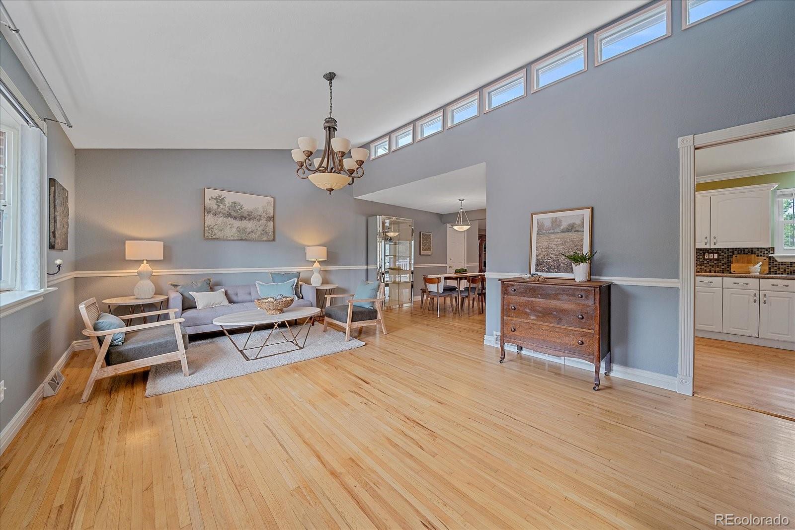 6072 Pierson Court Arvada, CO 80004 - Photo 1 of 31 a living room with furniture and wooden floor