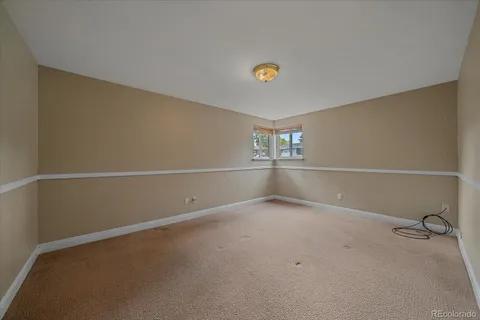 an empty room with a empty space and windows