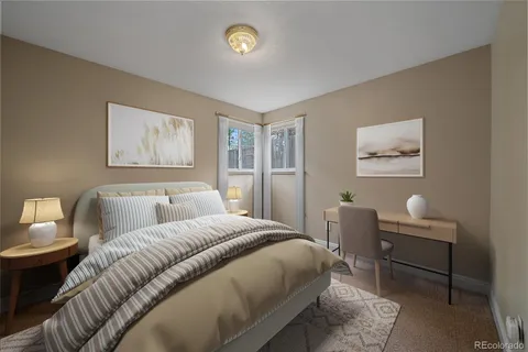 a bed room with a bed and a couch