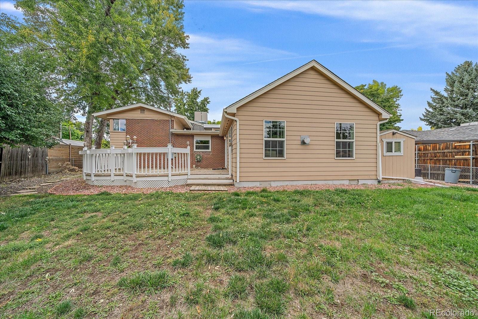 6072 Pierson Court Arvada, CO 80004 - Photo 26 of 31 a view of a house with a yard