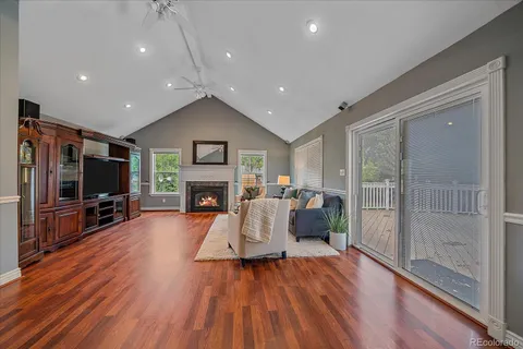 a living room with furniture fireplace and flat screen tv