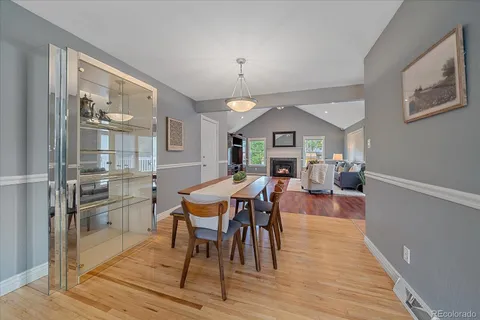 a view of a dining room with furniture window and wooden floor