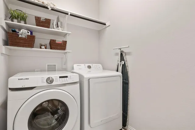 a utility room with dryer and washer
