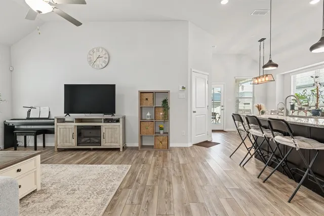 a view of a livingroom with furniture and a flat screen tv