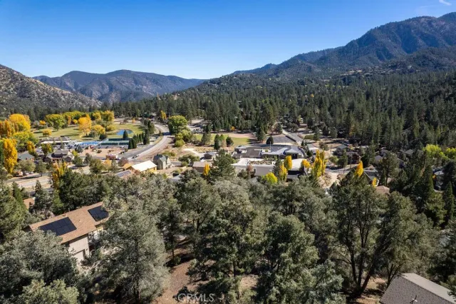 an aerial view of house with mountain view