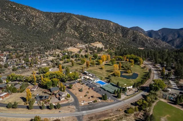 an aerial view of residential house and car parked