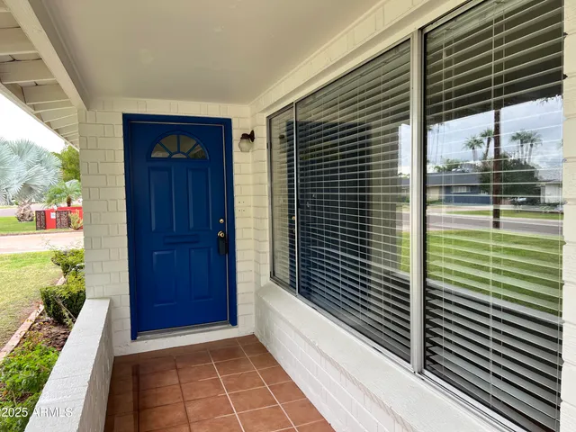 a view of hallway with a balcony