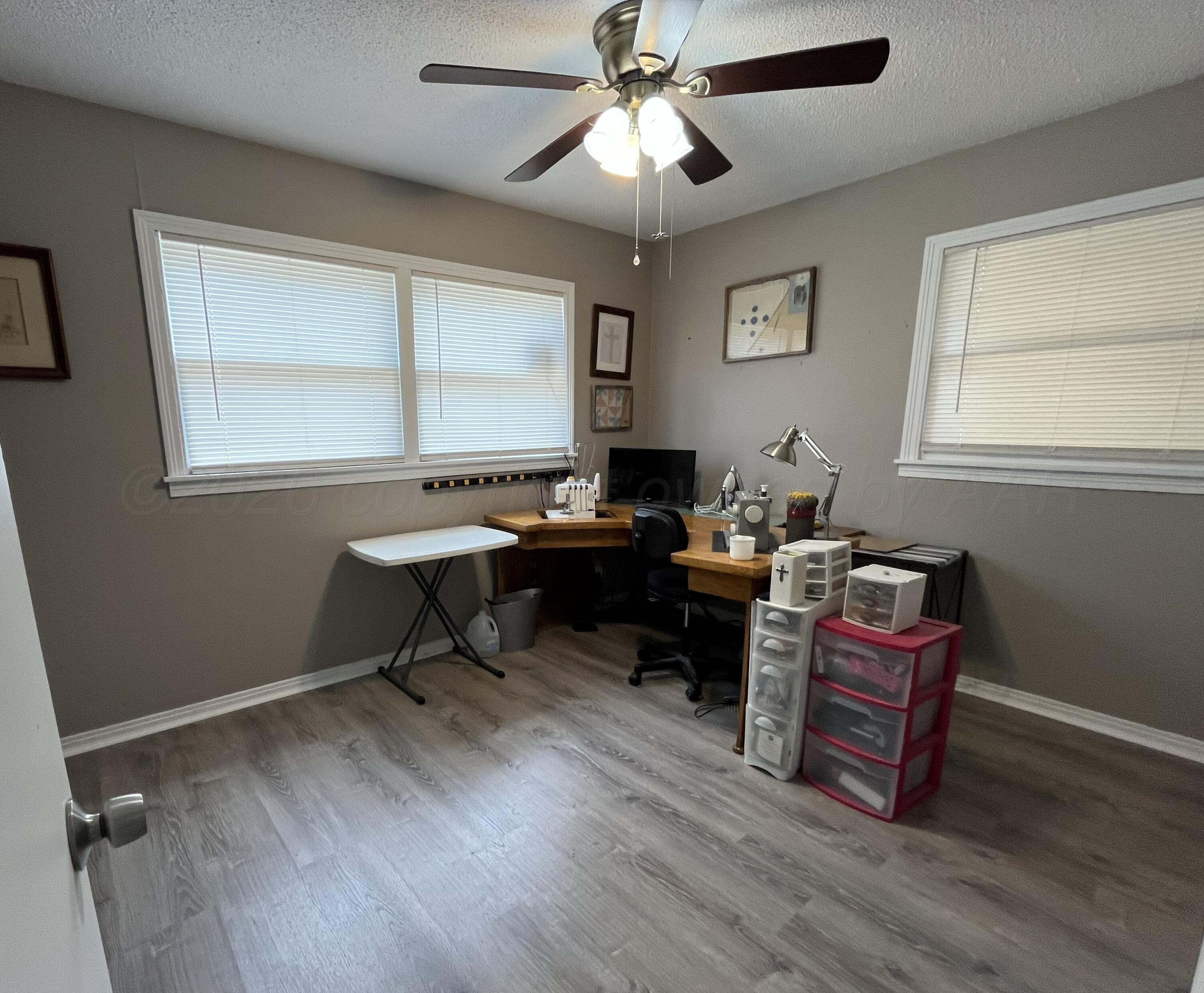 5105 James Avenue Amarillo, TX 79106 - Photo 11 of 21 a view of a workspace with furniture and a window
