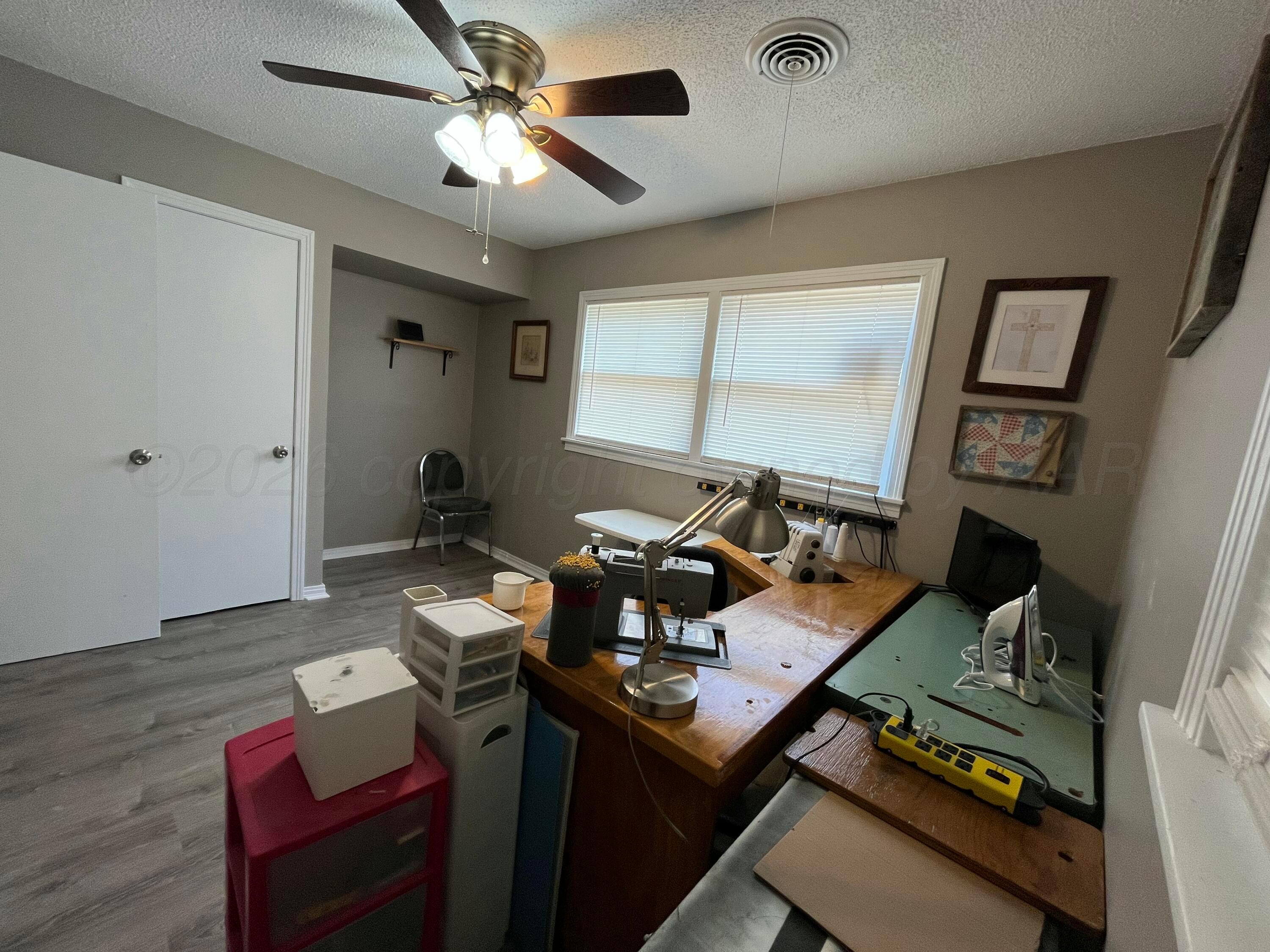 5105 James Avenue Amarillo, TX 79106 - Photo 12 of 21 a view of a workspace with furniture and a window