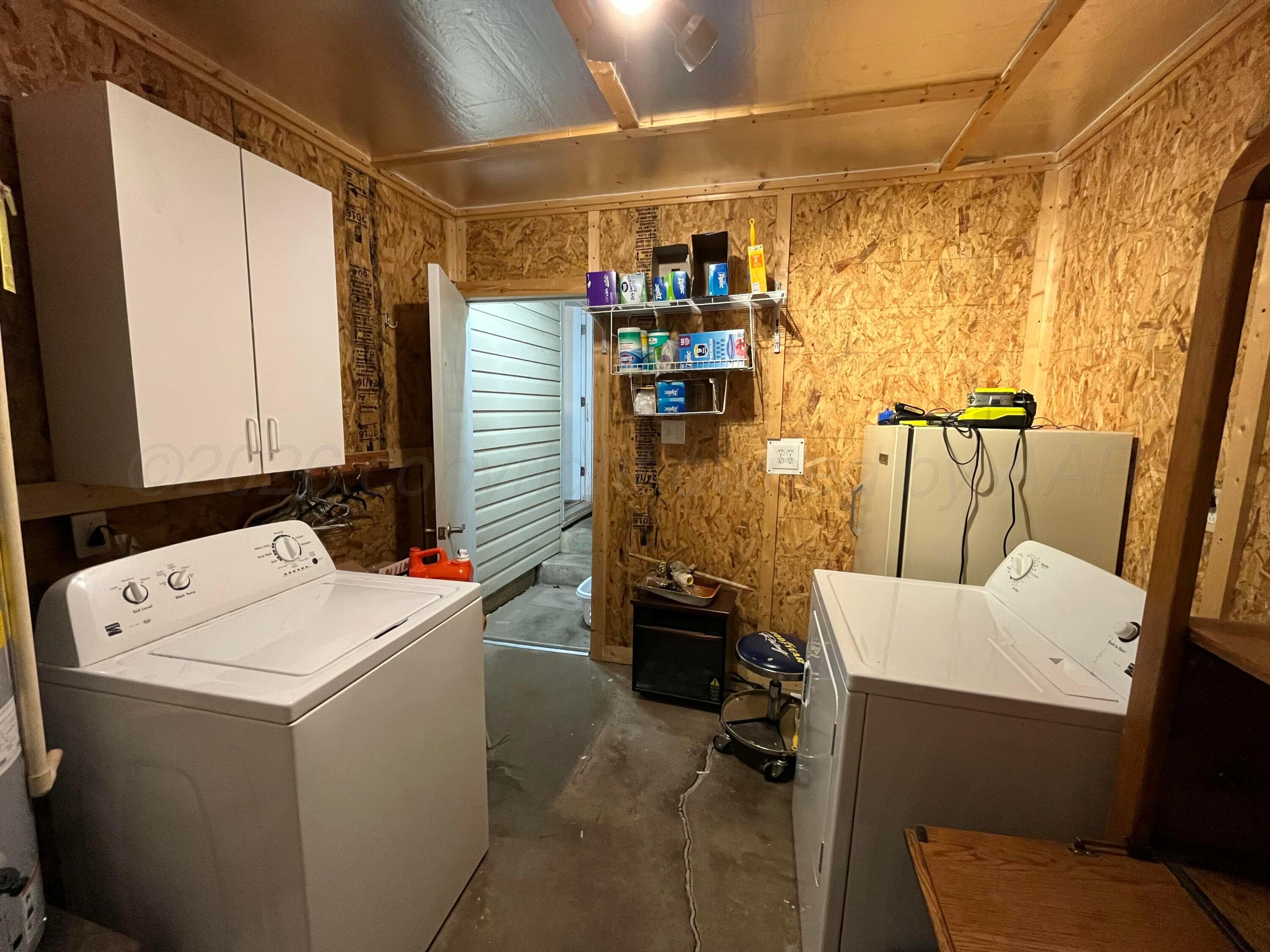 5105 James Avenue Amarillo, TX 79106 - Photo 19 of 21 a utility room with dryer and washer