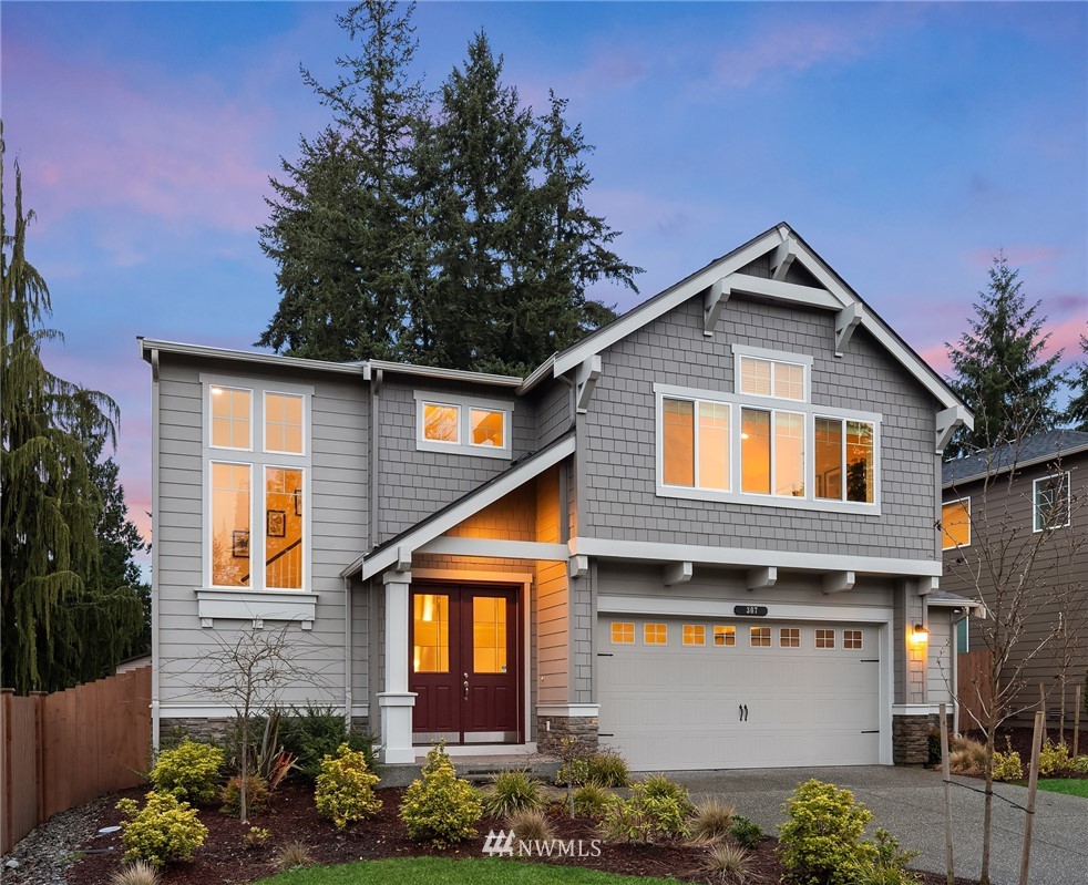 307 221st Place Southwest Bothell, WA 98021 - Photo 1 of 29 a front view of a house with a yard