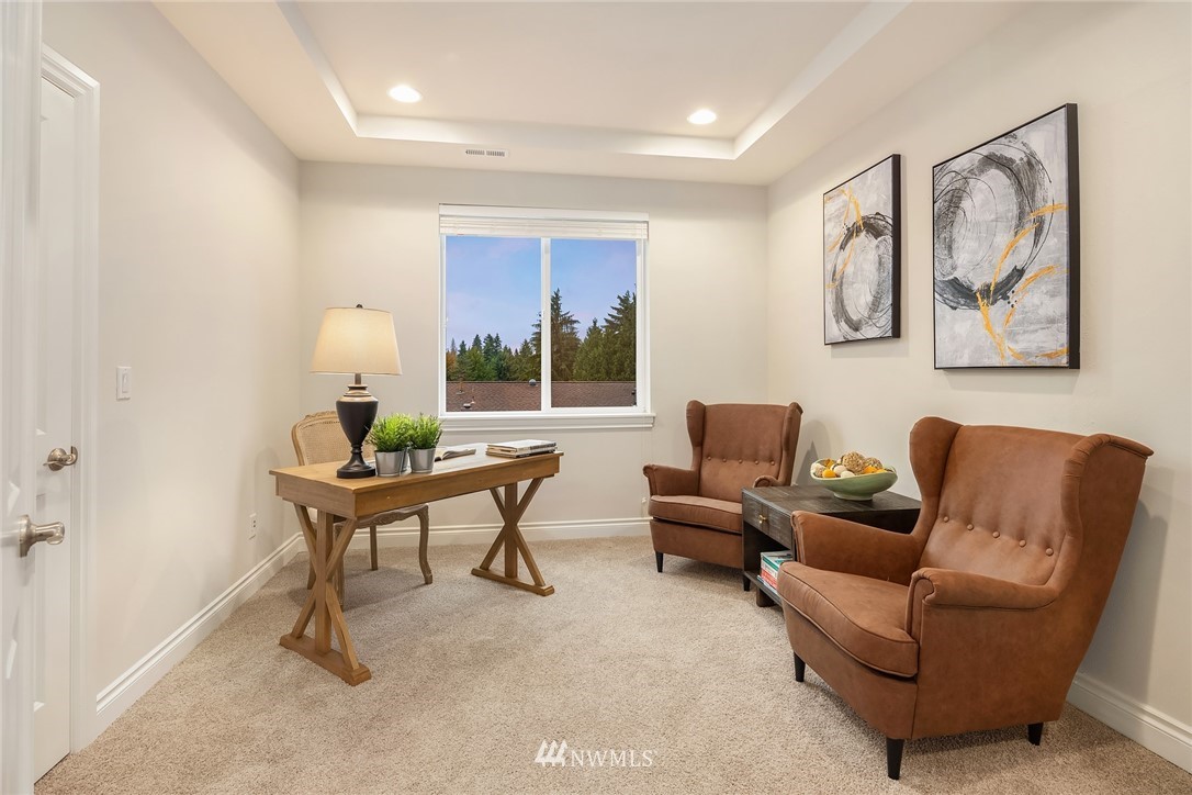 307 221st Place Southwest Bothell, WA 98021 - Photo 14 of 29 a living room with furniture and a window