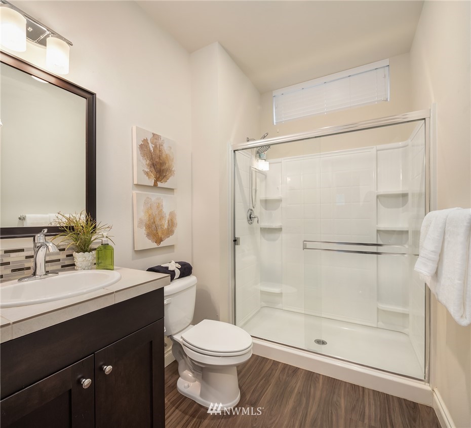 307 221st Place Southwest Bothell, WA 98021 - Photo 15 of 29 a bathroom with a double vanity sink toilet and shower