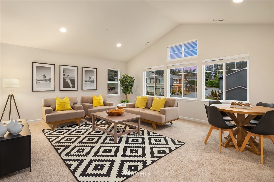 307 221st Place Southwest Bothell, WA 98021 - Photo 16 of 29 a living room with furniture windows and wooden floor