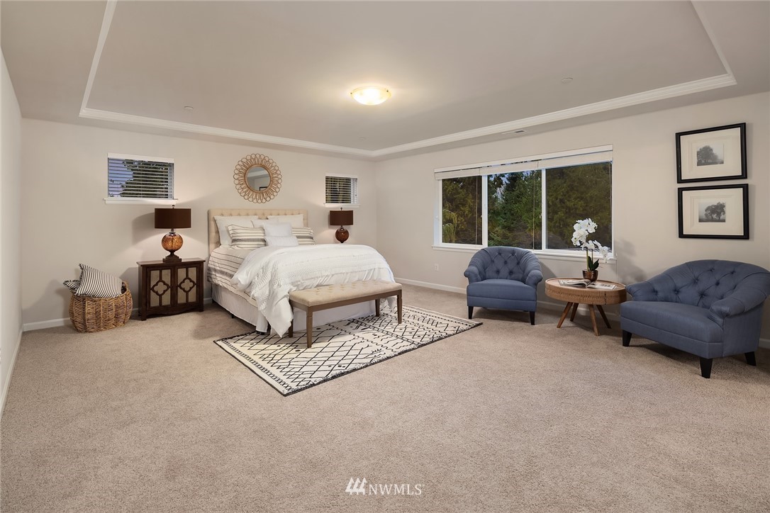 307 221st Place Southwest Bothell, WA 98021 - Photo 18 of 29 a living room with furniture and a large window