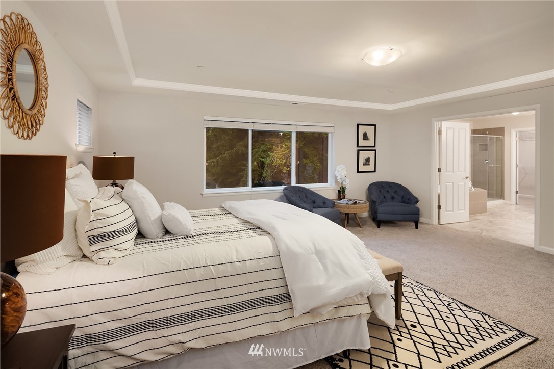 307 221st Place Southwest Bothell, WA 98021 - Photo 19 of 29 a bedroom with a bed and wooden floor