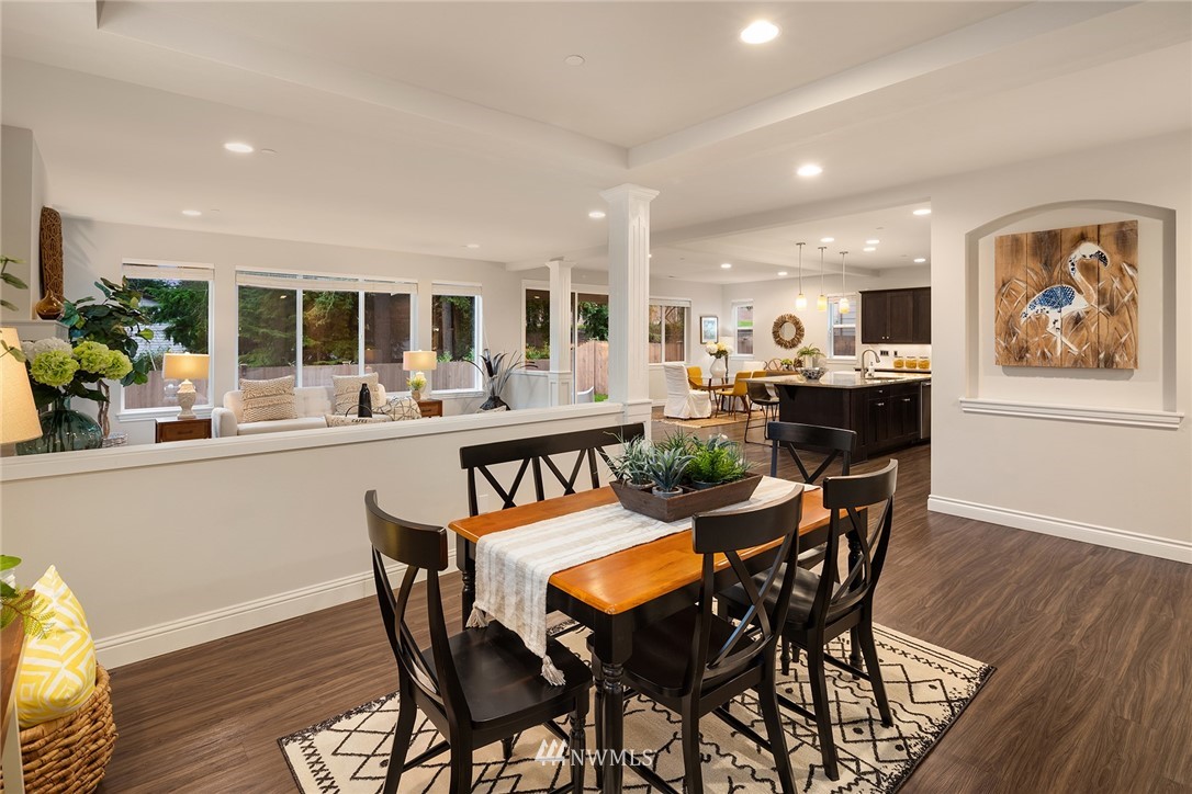 307 221st Place Southwest Bothell, WA 98021 - Photo 3 of 29 a dining room with furniture a rug and wooden floor
