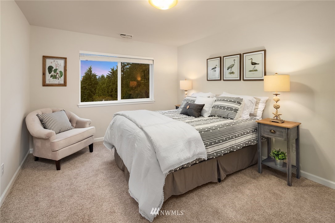 307 221st Place Southwest Bothell, WA 98021 - Photo 22 of 29 a bedroom with a bed and a couch