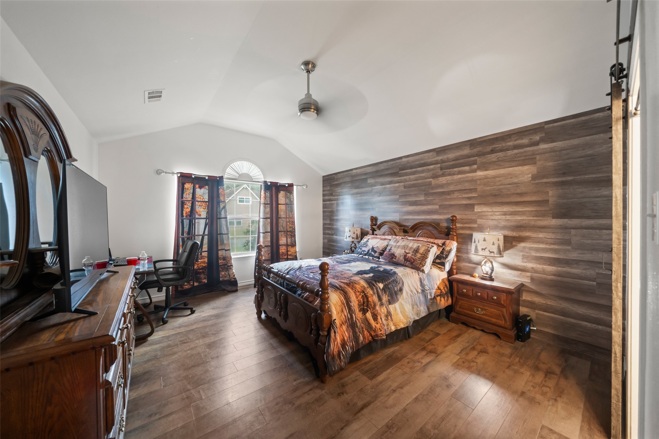 25434 Cedar Lane Splendora, TX 77372 - Photo 11 of 29 a bed room with a bed and wooden floor