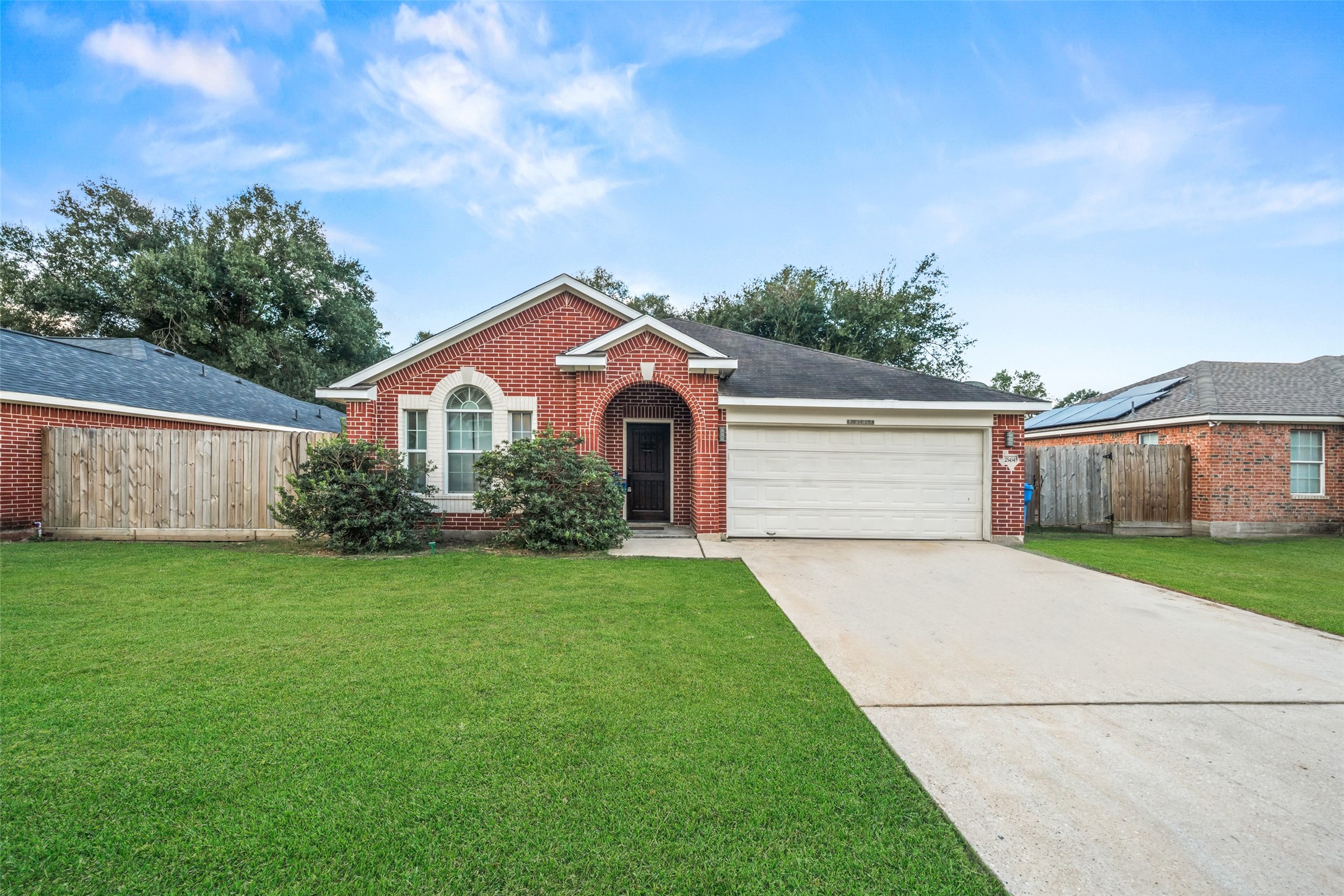 25434 Cedar Lane Splendora, TX 77372 - Photo 27 of 29 a front view of a house with a yard and garage