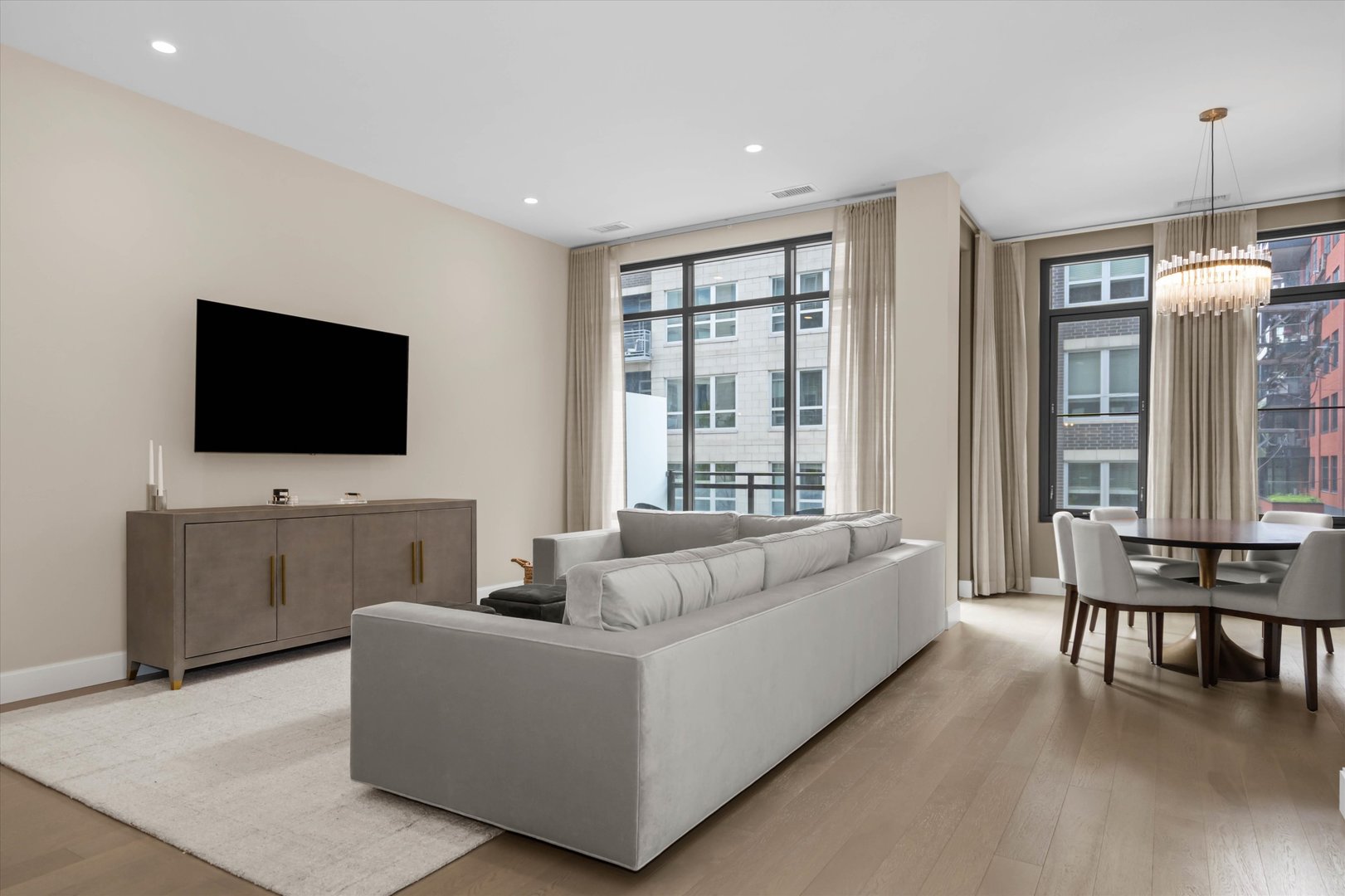 31 North Aberdeen Street, Unit 2S Chicago, IL 60607 - Photo 14 of 33 a living room with furniture and a flat screen tv