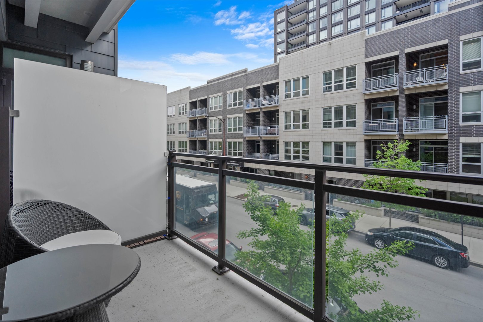31 North Aberdeen Street, Unit 2S Chicago, IL 60607 - Photo 20 of 33 a balcony view with couple of chairs