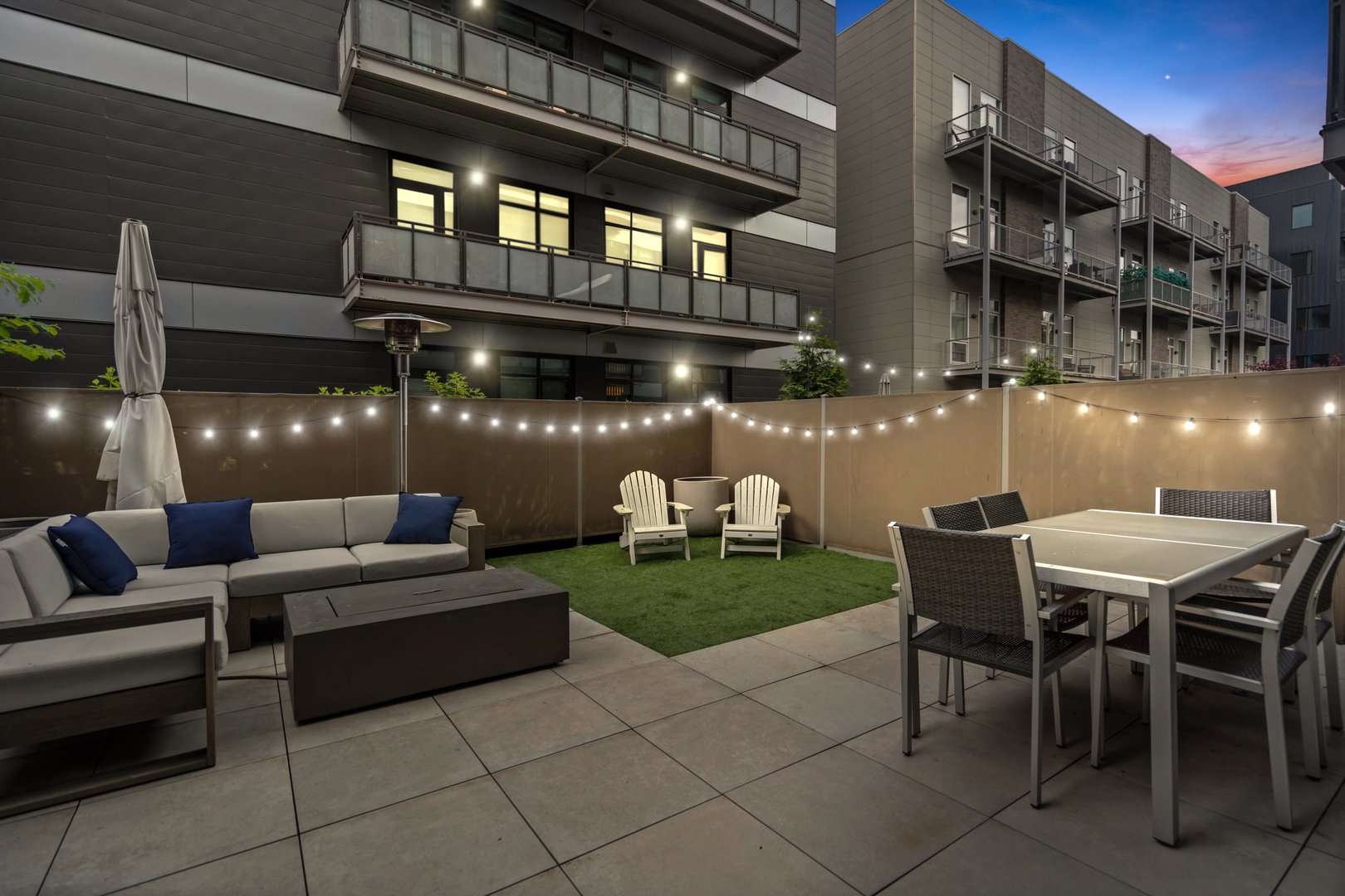 31 North Aberdeen Street, Unit 2S Chicago, IL 60607 - Photo 2 of 33 a patio with a table and chairs and a barbeque