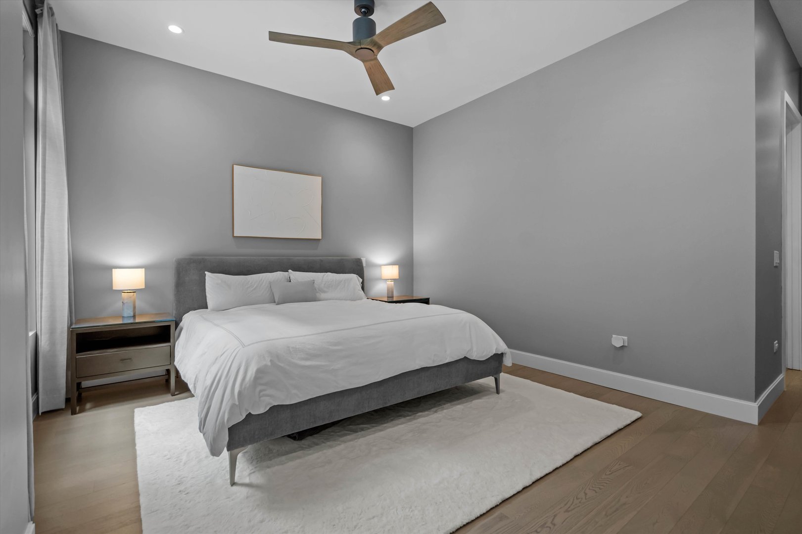 31 North Aberdeen Street, Unit 2S Chicago, IL 60607 - Photo 26 of 33 a bedroom with a bed and a ceiling fan