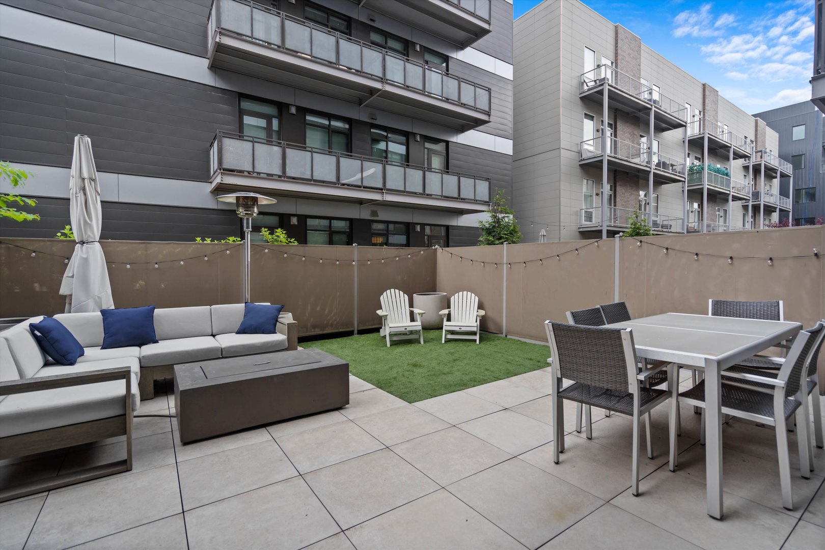 31 North Aberdeen Street, Unit 2S Chicago, IL 60607 - Photo 3 of 33 a view of a patio with table and chairs and potted plants