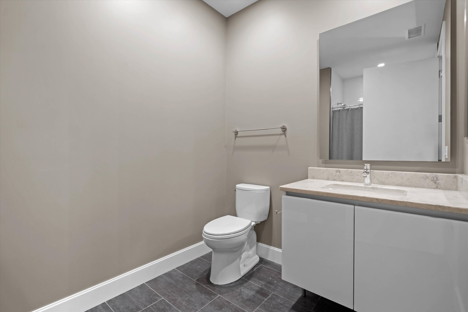 31 North Aberdeen Street, Unit 2S Chicago, IL 60607 - Photo 31 of 33 a bathroom with a toilet sink and mirror