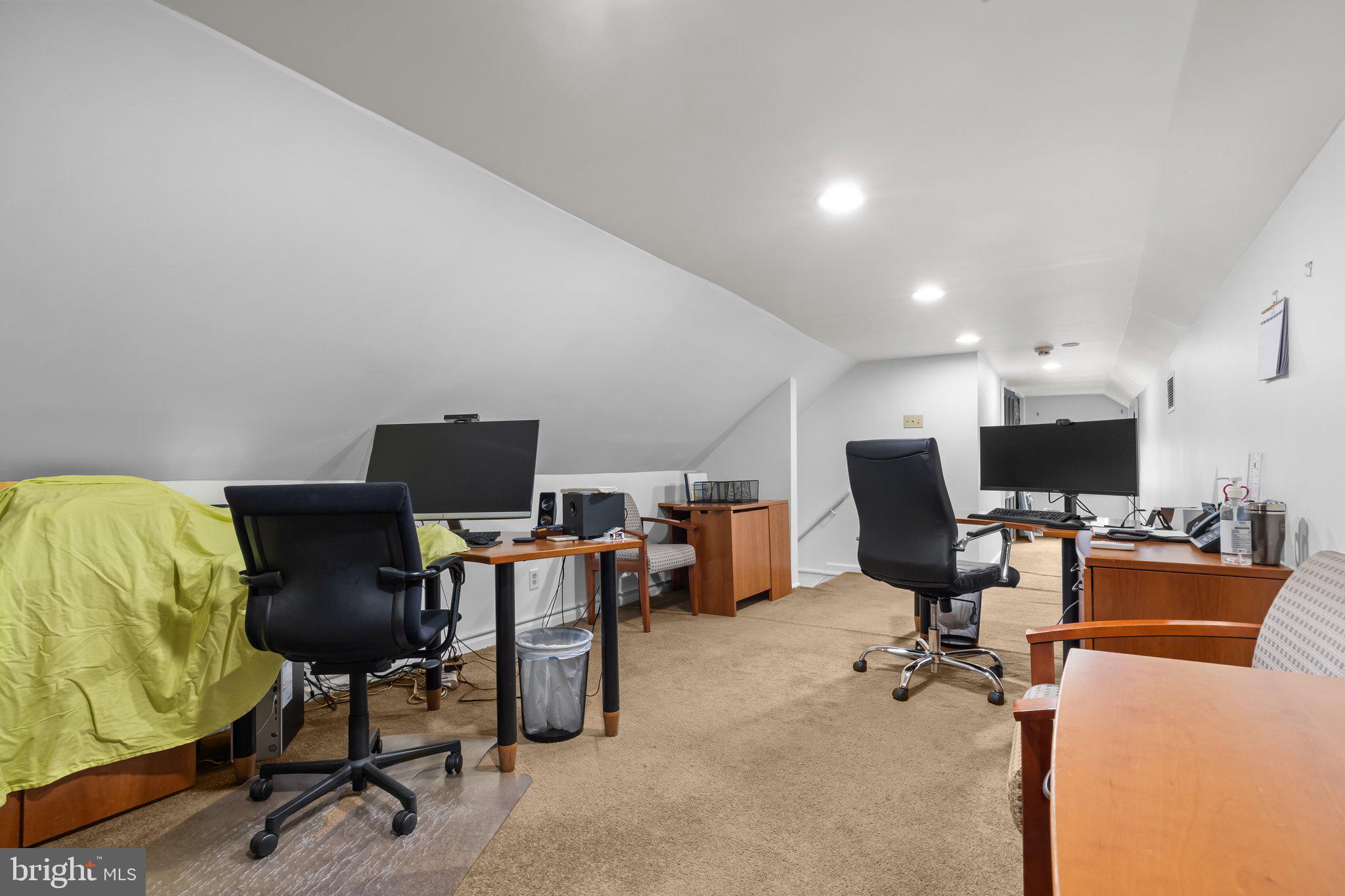 111 South State Street Newtown, PA 18940 - Photo 12 of 37 a view of a workspace with furniture and a chair