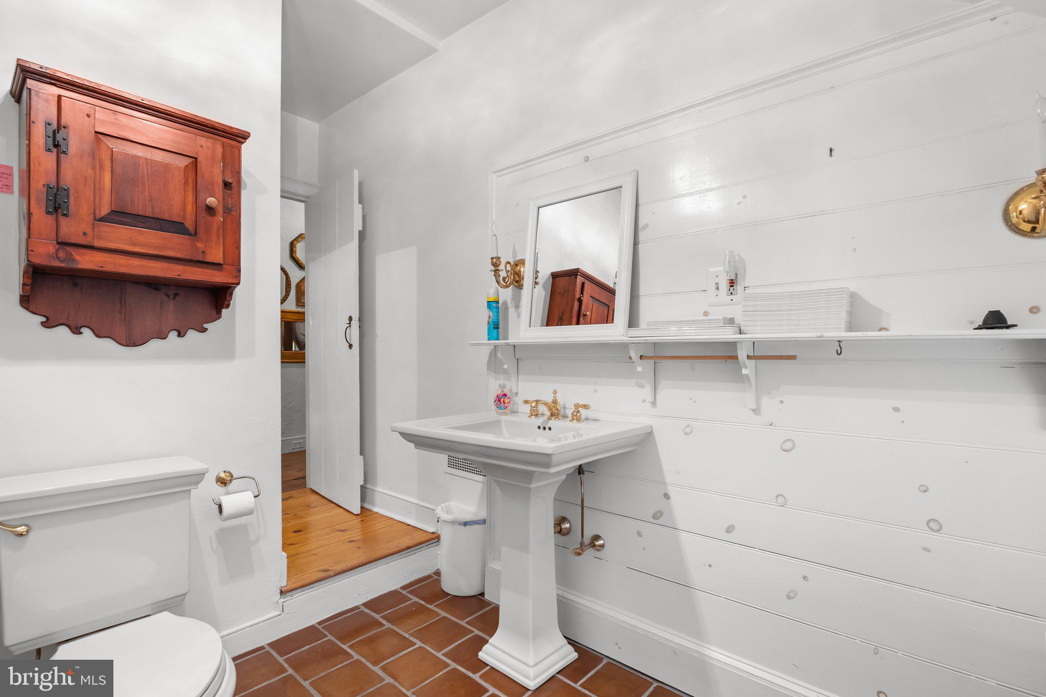 111 South State Street Newtown, PA 18940 - Photo 21 of 37 a bathroom with a sink toilet and shower