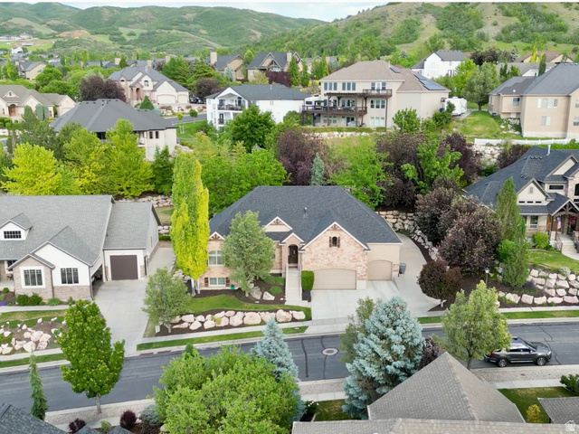 577 South Ridge Top Lane East North Salt Lake, UT 84054 - Photo 55 of 57 From the front of the home, enjoy long neighborhood views, beautiful tree-lined streets, and dramatic mountain backdrops that showcase the beauty of this sought-after community.