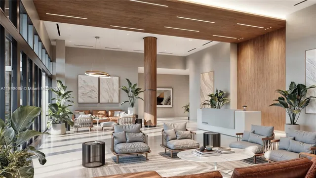 a living room with furniture and a potted plant