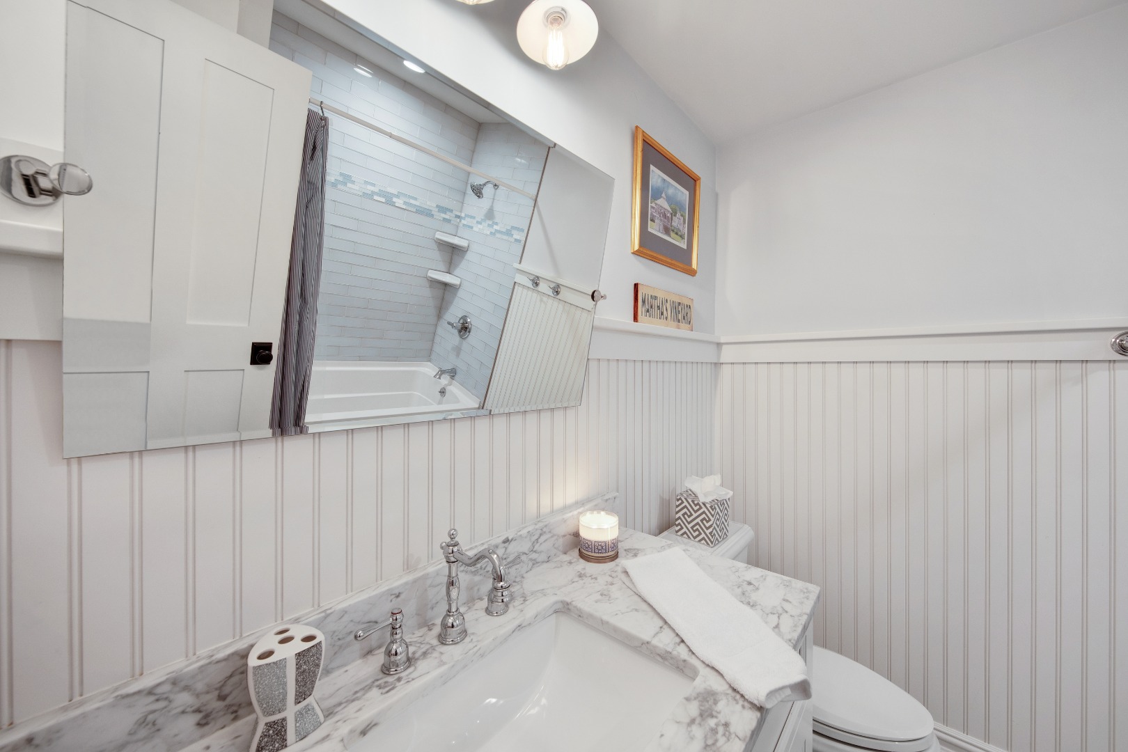 53 Pinehurst Road Edgartown, MA 02539 - Photo 21 of 26 a bathroom with a sink a toilet and shower