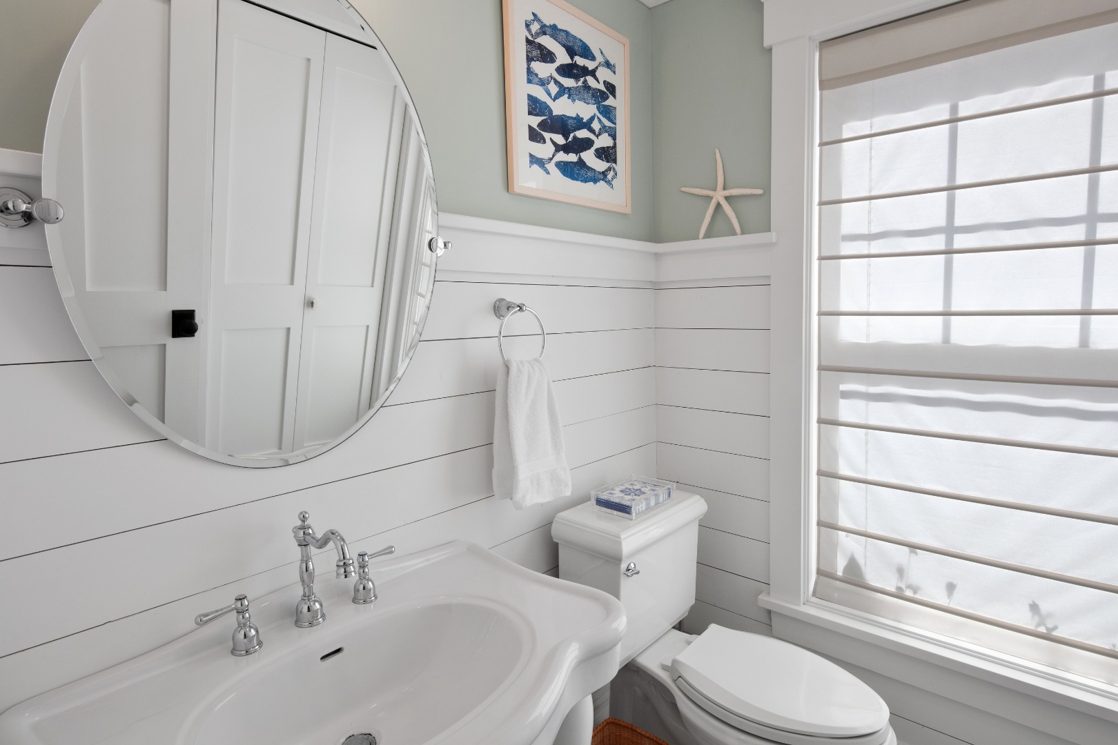 53 Pinehurst Road Edgartown, MA 02539 - Photo 22 of 26 a bathroom with a toilet sink and mirror