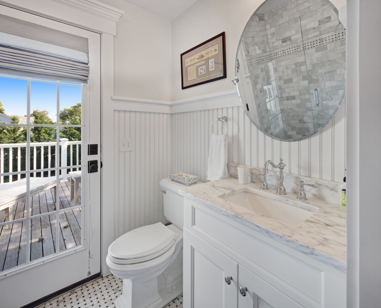 53 Pinehurst Road Edgartown, MA 02539 - Photo 23 of 26 a bathroom with a granite countertop toilet sink and mirror