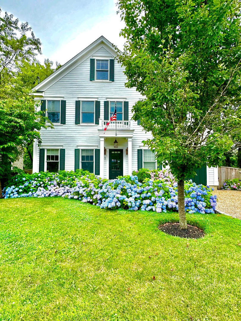 53 Pinehurst Road Edgartown, MA 02539 - Photo 26 of 26 a front view of a house with a yard