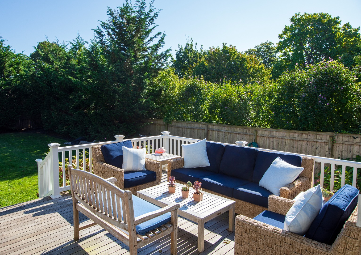 53 Pinehurst Road Edgartown, MA 02539 - Photo 3 of 26 a balcony with wooden floor and outdoor seating