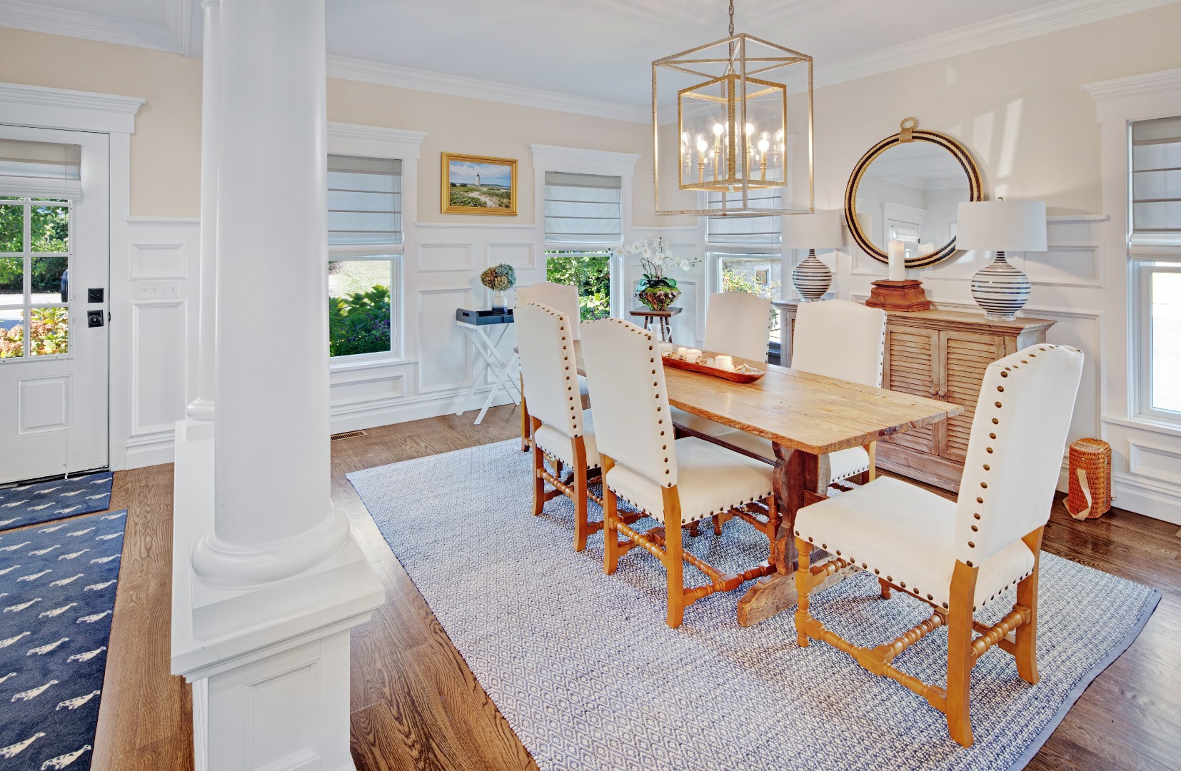 53 Pinehurst Road Edgartown, MA 02539 - Photo 6 of 26 a dining room with furniture a potted plant and a chandelier