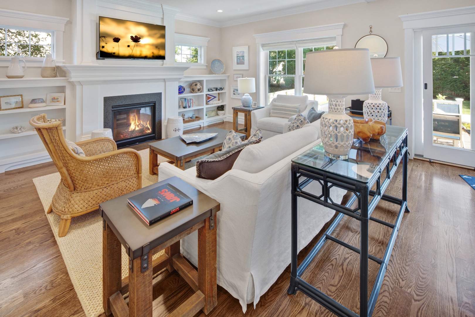 53 Pinehurst Road Edgartown, MA 02539 - Photo 9 of 26 a living room with furniture a flat screen tv and a fireplace