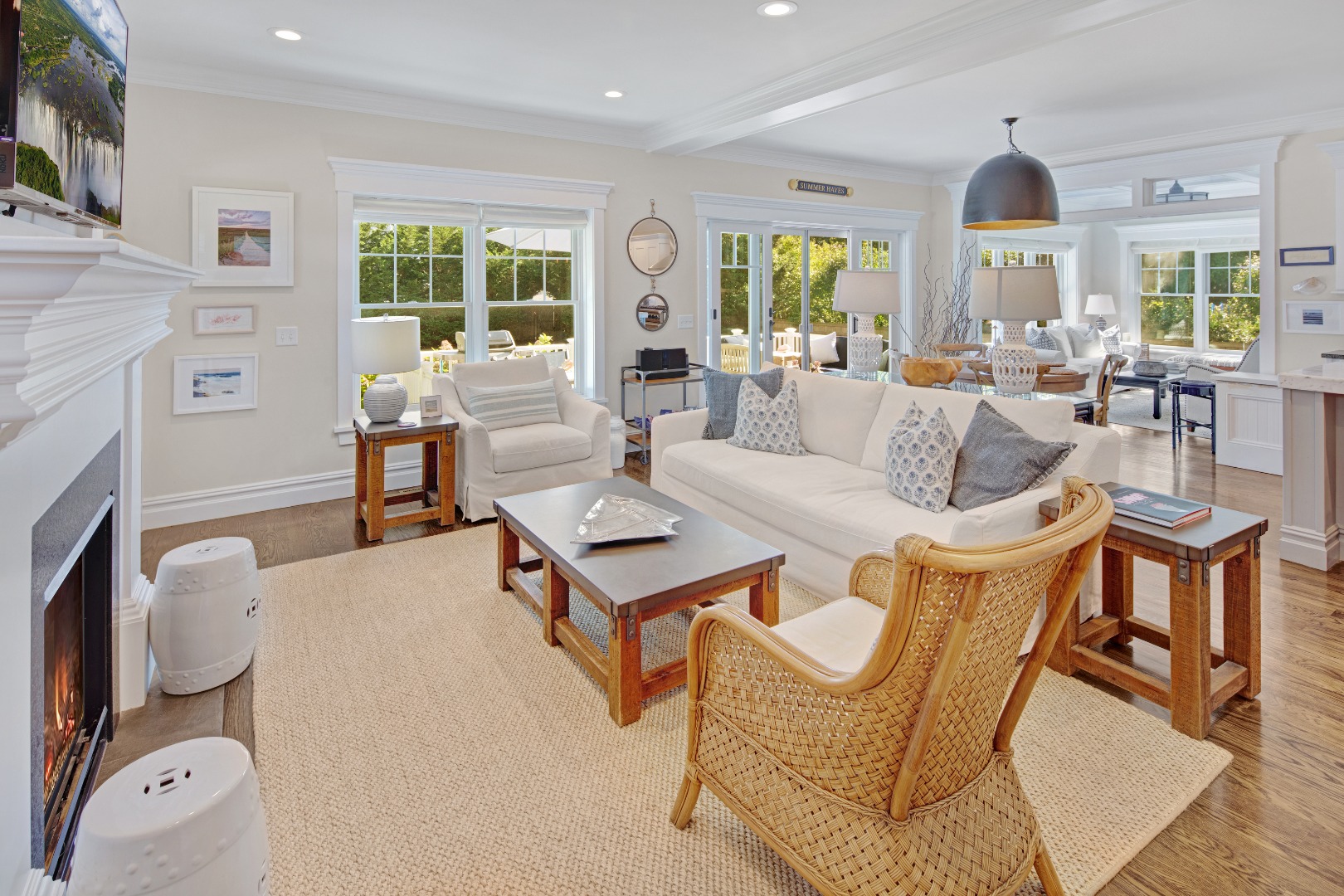 53 Pinehurst Road Edgartown, MA 02539 - Photo 10 of 26 a living room with furniture a fireplace and a flat screen tv