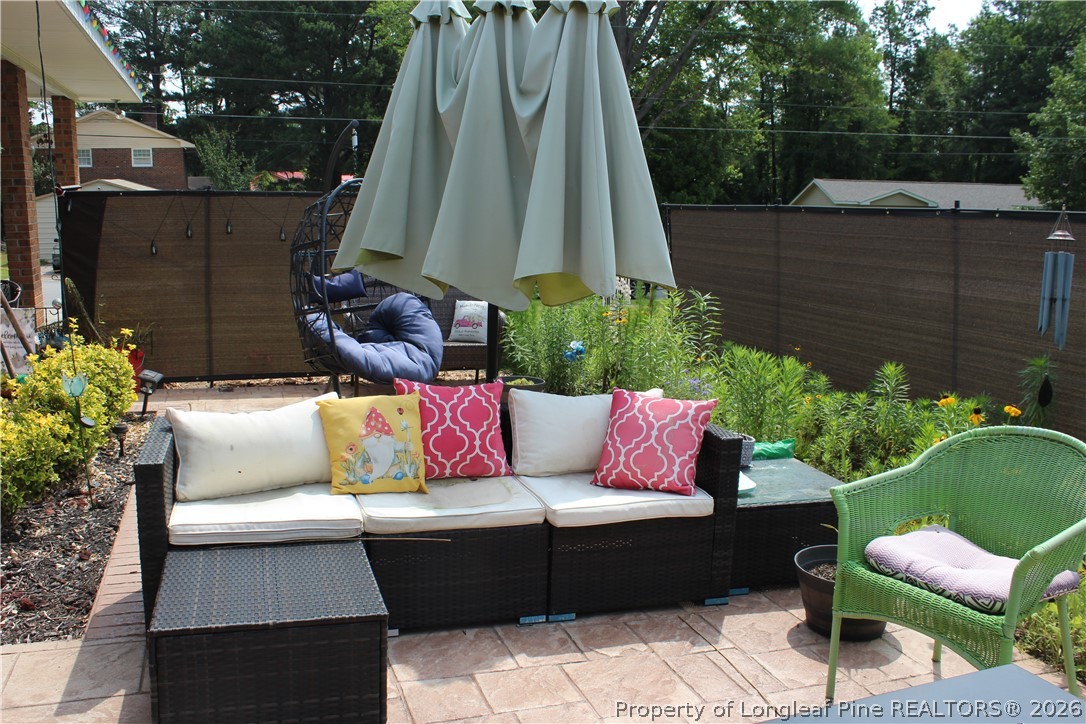 2038 Dunn Road Eastover, NC 28312 - Photo 24 of 29 a view of a tables and chairs in a patio