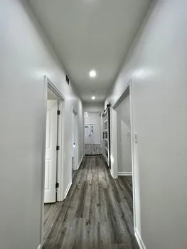 a view of entryway with wooden floor